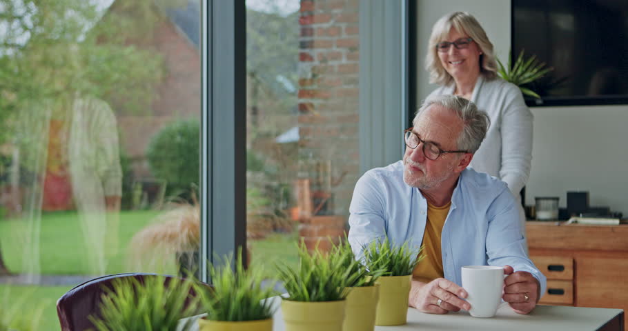 Hug, coffee or happy old couple embrace with love or care in marriage, retirement or morning at home. Tea, romantic elderly man or senior woman hugging or bonding together on weekend break to relax