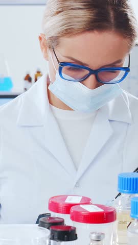 Scientific laboratory filled with various research equipment. Scientists are conducting experiments and research. Science and technology concept.