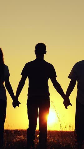 Teamwork of people raising hands to sun sky. Business teamwork of people in nature. Woman, man group of business people holding hands, raising hands to sky. Business people outdoors, partners, trust.