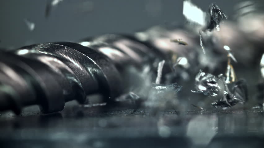Metal shavings fall onto the work surface. Filmed on a high-speed camera at 1000 fps. High quality FullHD footage