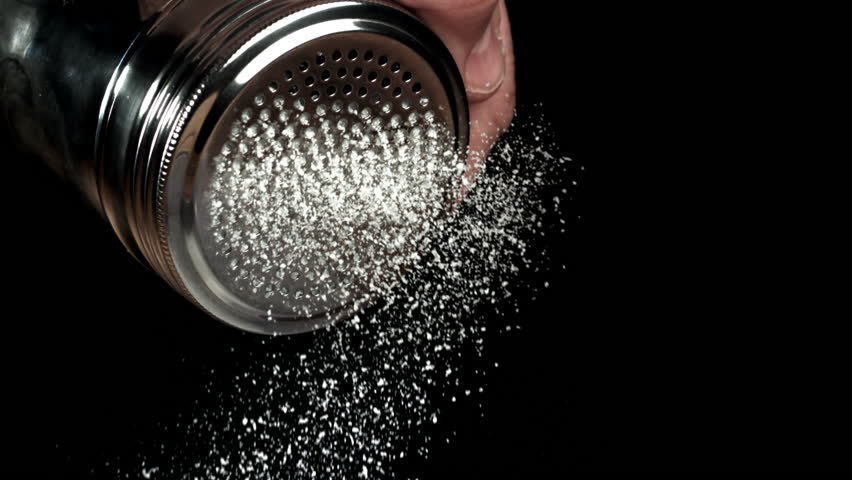 Salt is pouring out of the salt shaker. Filmed on a high-speed camera at 1000 fps. High quality FullHD footage
