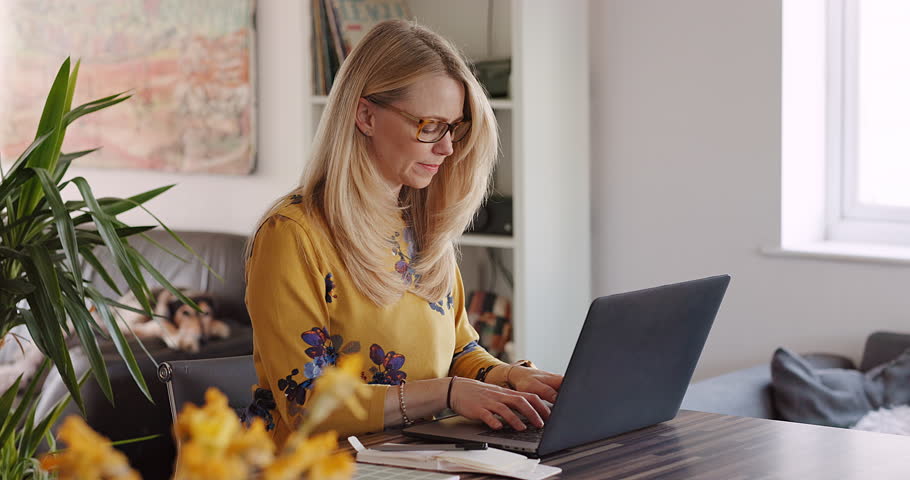 Typing, laptop and search with woman in home office for freelancer, remote work and website. Business, communication and internet with female working on email, networking and online administration