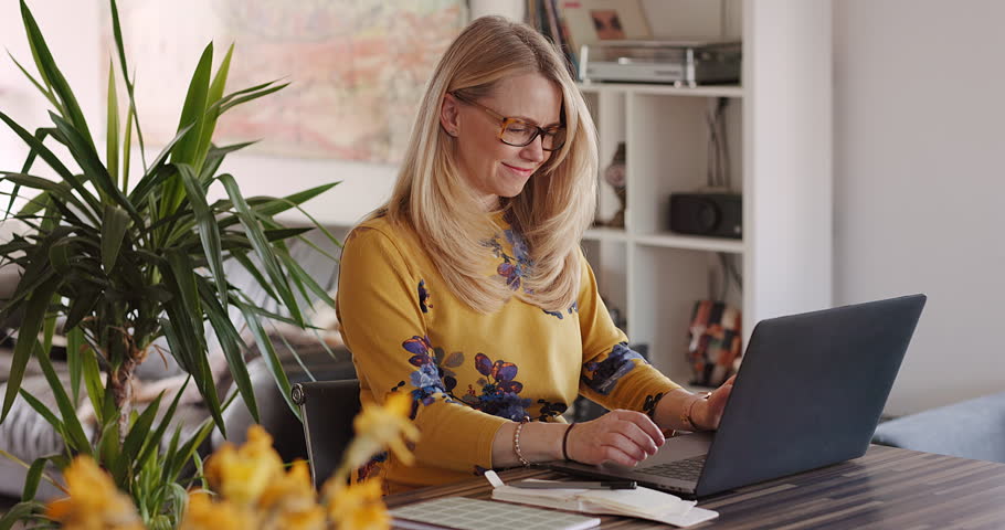 Typing, laptop and search with woman in home office for freelancer, remote work and website. Business, communication and internet with female working on email, networking and online administration