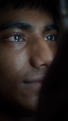 Focused gaze captures deep emotion while looking at smart phone screen 