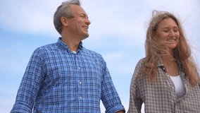 Romantic middle-aged couple enjoying a peaceful evening together on the beach. Love, connection, and togetherness concept for mature relationships and slow living lifestyle. - Powered by Shutterstock - Get 15% off with code: PIKWIZARD15
