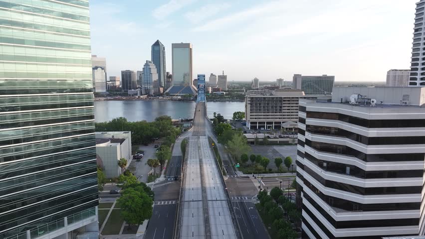 Cityscape aerial view from San Marco and downtown Jacksonville, Florida, on a beautiful blue-sky spring day, with the river, and tall buildings.