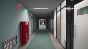 Hallway designed with modern materials and muted lighting. Structure serves clinical efficiency. Corridor guides flow of daily operations - Powered by Shutterstock - Get 15% off with code: PIKWIZARD15