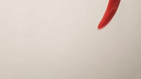 Chili Peppers Submerging into Water with Bubbles Rising - Powered by Shutterstock - Get 15% off with code: PIKWIZARD15