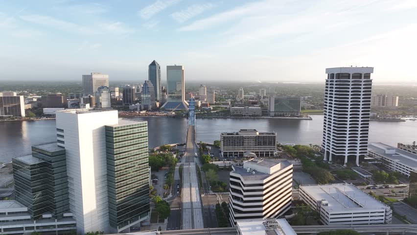 Cityscape aerial view from San Marco and downtown Jacksonville, Florida, on a beautiful blue-sky spring day, with the river, and tall buildings.