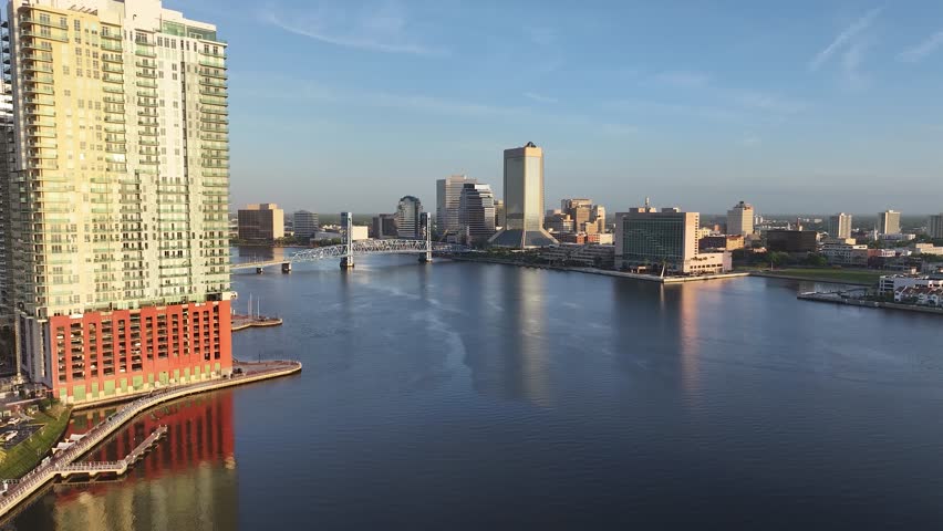 Cityscape aerial view from San Marco and downtown Jacksonville, Florida, on a beautiful blue-sky spring day, with the river, and tall buildings.
