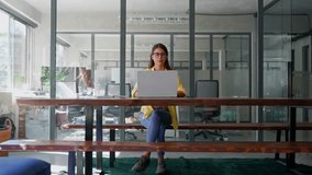 Thinking latin hispanic female marketing manager, professional specialist looking at screen working at laptop computer sitting in office. Young woman employee using pc for business. Wide, copy space - Powered by Shutterstock - Get 15% off with code: PIKWIZARD15