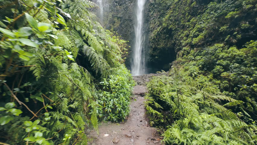 Waterfall in Madeira island. Clear water in highland in Madeira, slashing down. POV view and handheld shot