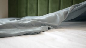 Soft gray sheets on a bed with smooth white linens in a cozy room - Powered by Shutterstock - Get 15% off with code: PIKWIZARD15