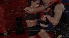 Teenage boy practicing punches with coach holding pad inside fitness gym, featuring mesh overlay. Athletics, training, fitness, strength, discipline, motion, competitive - Powered by Shutterstock - Get 15% off with code: PIKWIZARD15