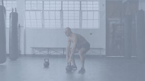 Muscular man swinging kettlebell in fitness studio, showing animated strength graph overlay. Strength, training, athletics, wellness, motion, dynamic, gym - Powered by Shutterstock - Get 15% off with code: PIKWIZARD15