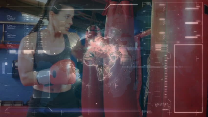 female boxer delivering kick in boxing gym, featuring digital HUD scanning data and glowing globe. Athleticism, fitness, training, cybersports, technology, futuristic, strength - Powered by Shutterstock - Get 15% off with code: PIKWIZARD15