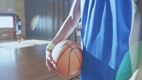 male basketball team practicing sports drills in gym, displaying animated performance charts. Athletics, teamwork, training, sportswear, fitness, recreation, youthful - Powered by Shutterstock - Get 15% off with code: PIKWIZARD15