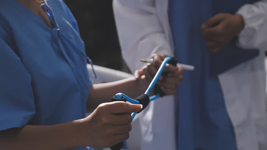 Physical therapist working with patient on upper extremity exerc