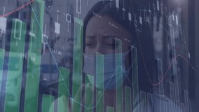 woman checking smartphone indoors while viewing finance charts with green bars and candlesticks. Technology, finance, data visualization, analytics, investment, digital economy, business - Powered by Shutterstock - Get 15% off with code: PIKWIZARD15