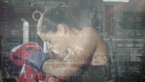 Female boxer leaning forward against red punching bag in gym, displaying floating health metrics. Athlete, fitness, sport, strength, determination, energy, training - Powered by Shutterstock - Get 15% off with code: PIKWIZARD15