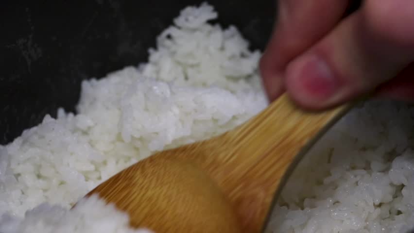 Put the rice from the rice cooker into a bowl