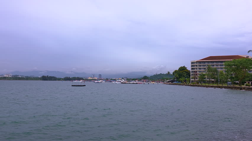 Boats And Seafront Hotels On A Cloudy Day In Kota Kinabalu, Sabah, Malaysia. - wide shot