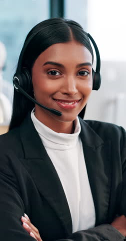Face, call center and woman in office, arms crossed and telemarketing with help desk, crm or friendly service. Person, employee or agent with headset, pride or confidence with customer support or faq