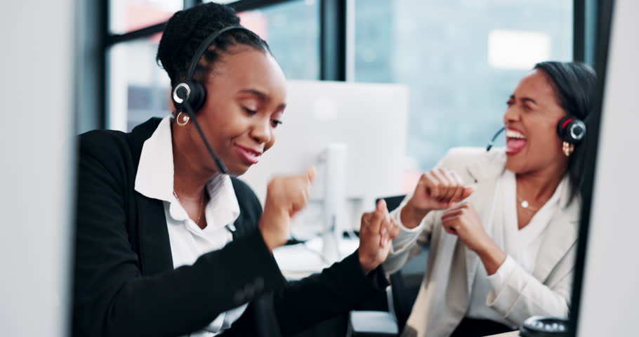Women, call center and happy for dancing with headset in office for success, goals or target. Person, customer support and consultant team with celebration for lead generation with win at workplace