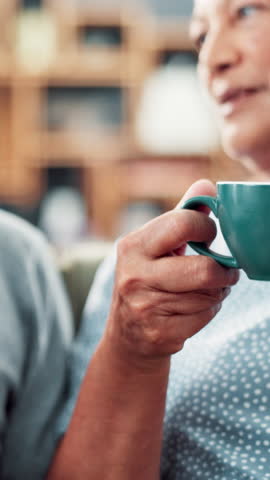 Hands, coffee and celebration with toast in home for senior couple with anniversary, love and connection. People, mug and cheers with drink, tea or latte in retirement with bonding in living room