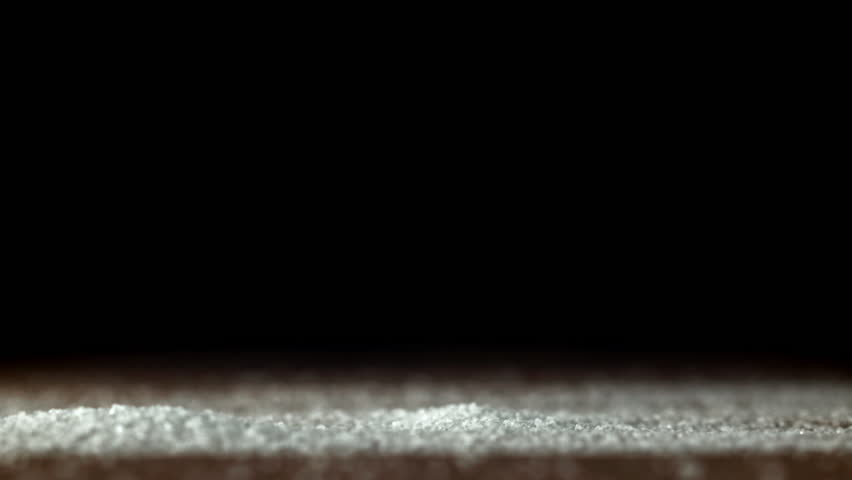 A salt shaker falls on a wooden table. Filmed on a high-speed camera at 1000 fps. High quality FullHD footage