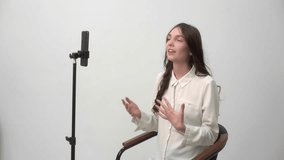 Engaged presenter conducting expressive presentation on modern microphone setup - Powered by Shutterstock - Get 15% off with code: PIKWIZARD15