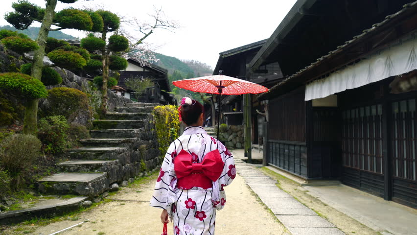 Asian woman wearing japanese traditional kimono at Tsumago juku in Nagano, Japan.