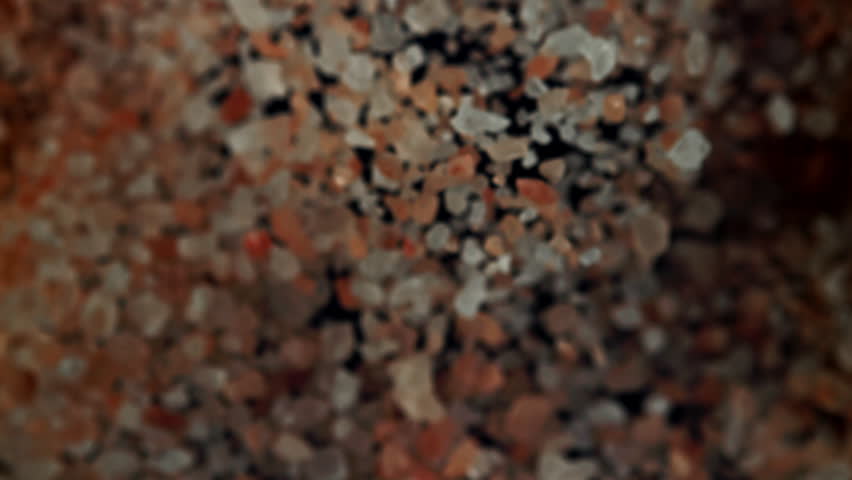 The pink salt flies up and down. Filmed on a high-speed camera at 1000 fps. High quality FullHD footage