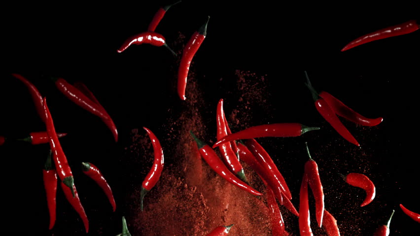 Red chili peppers fly up and fall down. Filmed on a high-speed camera at 1000 fps. High quality FullHD footage