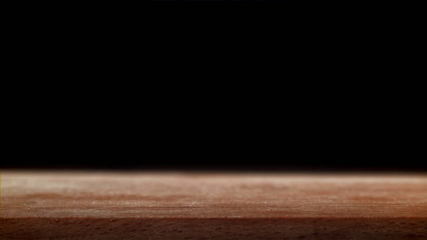 Pink salt falls on the table. Filmed on a high-speed camera at 1000 fps. High quality FullHD footage