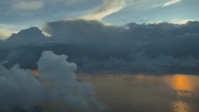 an immersive pilot perpective POV flying at sunrise over the sea, with some storm clouds ahead and the sunlight reflected on the water. - Powered by Shutterstock - Get 15% off with code: PIKWIZARD15