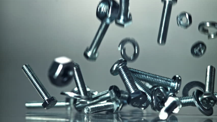 Falling nuts, bolts and washers on a metal table. Filmed on a high-speed camera at 1000 fps. High quality FullHD footage