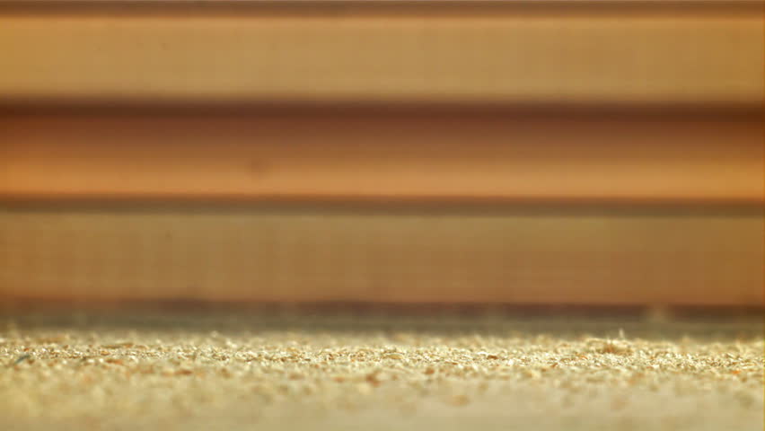 Wood sawdust on the carpenter's desktop. Filmed on a high-speed camera at 1000 fps. High quality FullHD footage