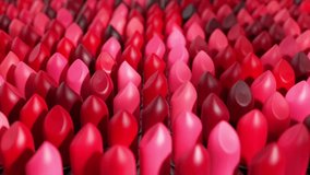 Rows of lipsticks in various shades of red and pink create a vibrant and textured pattern, emphasizing the diversity and abundance of color options available in cosmetics. 3D Illustration - Powered by Shutterstock - Get 15% off with code: PIKWIZARD15