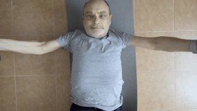 A determined senior man lifting dumbbells in a home environment, demonstrating strength and physical fitness. The image reflects dedication to personal health and resistance training  - Powered by Shutterstock - Get 15% off with code: PIKWIZARD15