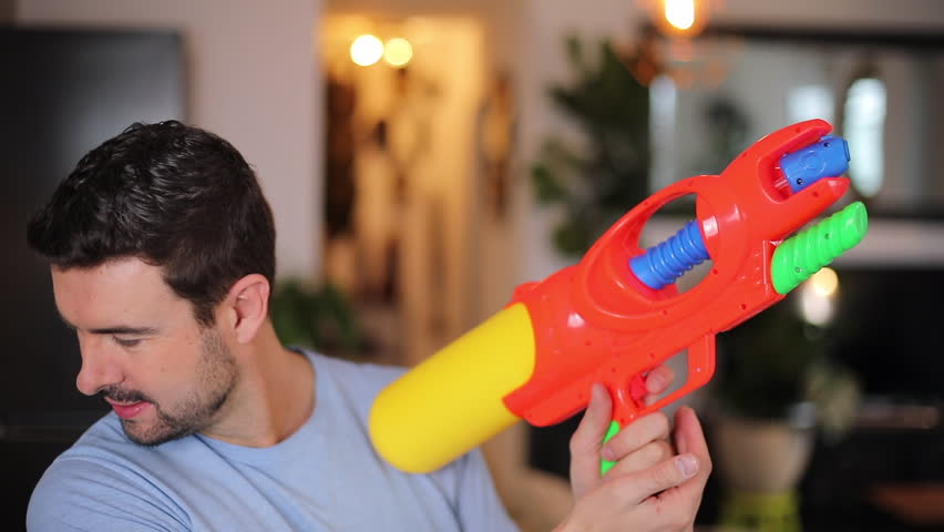 Funny man with his water-gun