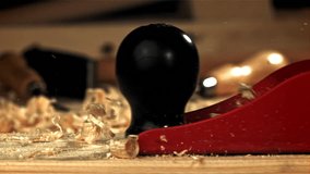 A carpenter is working on a wooden surface with a plane. Filmed on a high-speed camera at 1000 fps. High quality FullHD footage - Powered by Shutterstock - Get 15% off with code: PIKWIZARD15