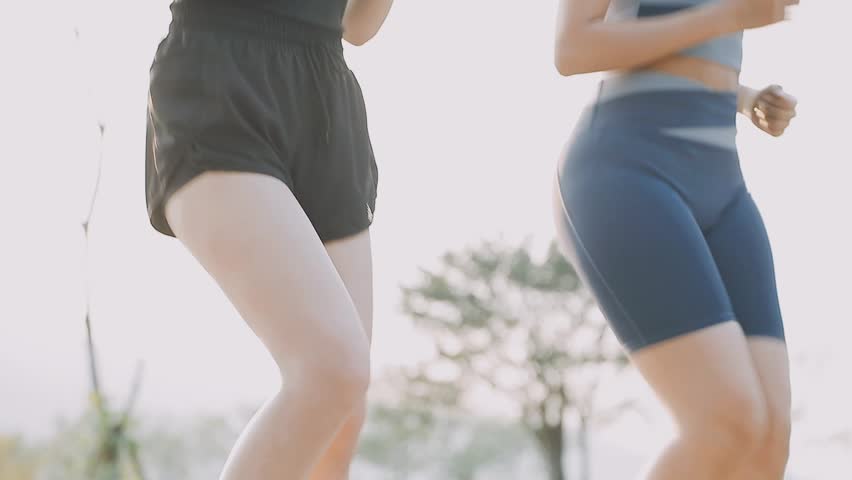 Couple doing stretching exercise after jogging