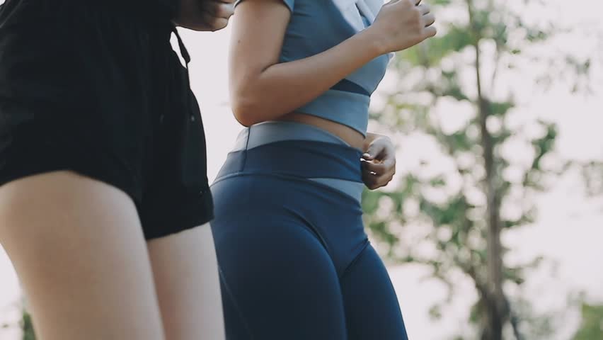 Couple doing stretching exercise after jogging