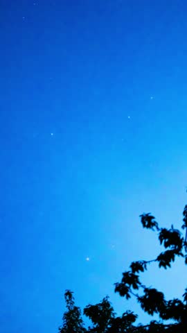 Timelapse of a night sky. Vertical video from the time the sky darkens until nightfall.