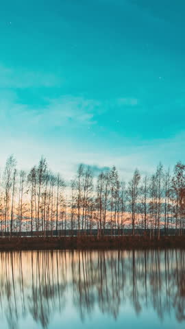Slider shot of Deep Night Stars Above Lake. Natural Starry Sky Landscape. Autumn River Landscape stars. Wooden Pier. Autumn Forest woods lake . Amazing Landscape Woodland Slider Time Lapse, Time-lapse