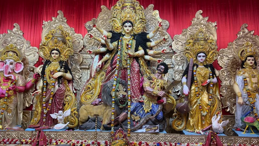 Wide shot of a big sized Durga maa idol at a famous puja pandal.