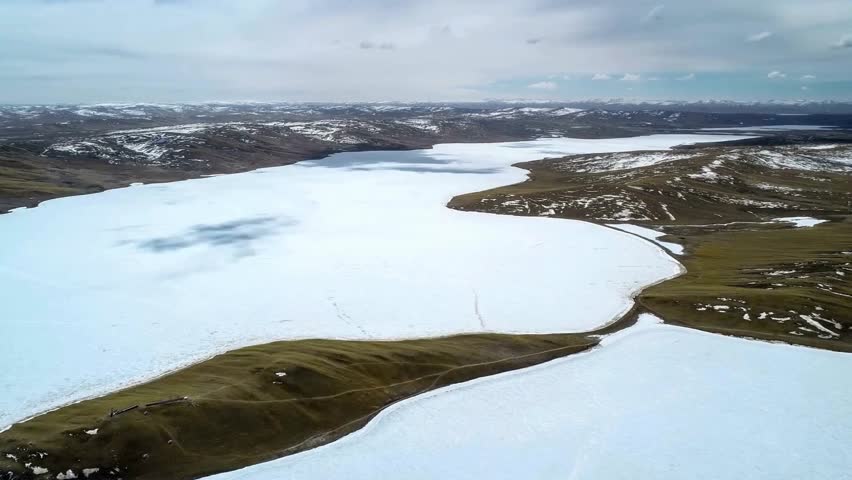 Aerial View of Frozen Lake and Island Landscape