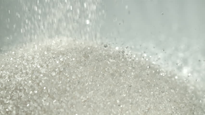 Sugar falls on the table in a heap. Filmed on a high-speed camera at 1000 fps. High quality FullHD footage