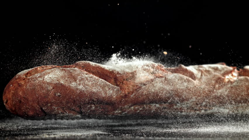 French rye baguette falls on the table. Filmed on a high-speed camera at 1000 fps. High quality FullHD footage